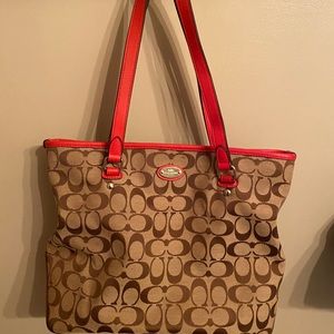 Coach shoulder bag with red accent